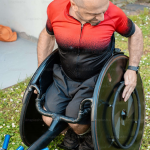 Man in a custom wheelchair.