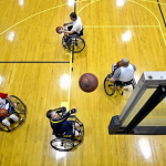 People playing wheelchair basketball.